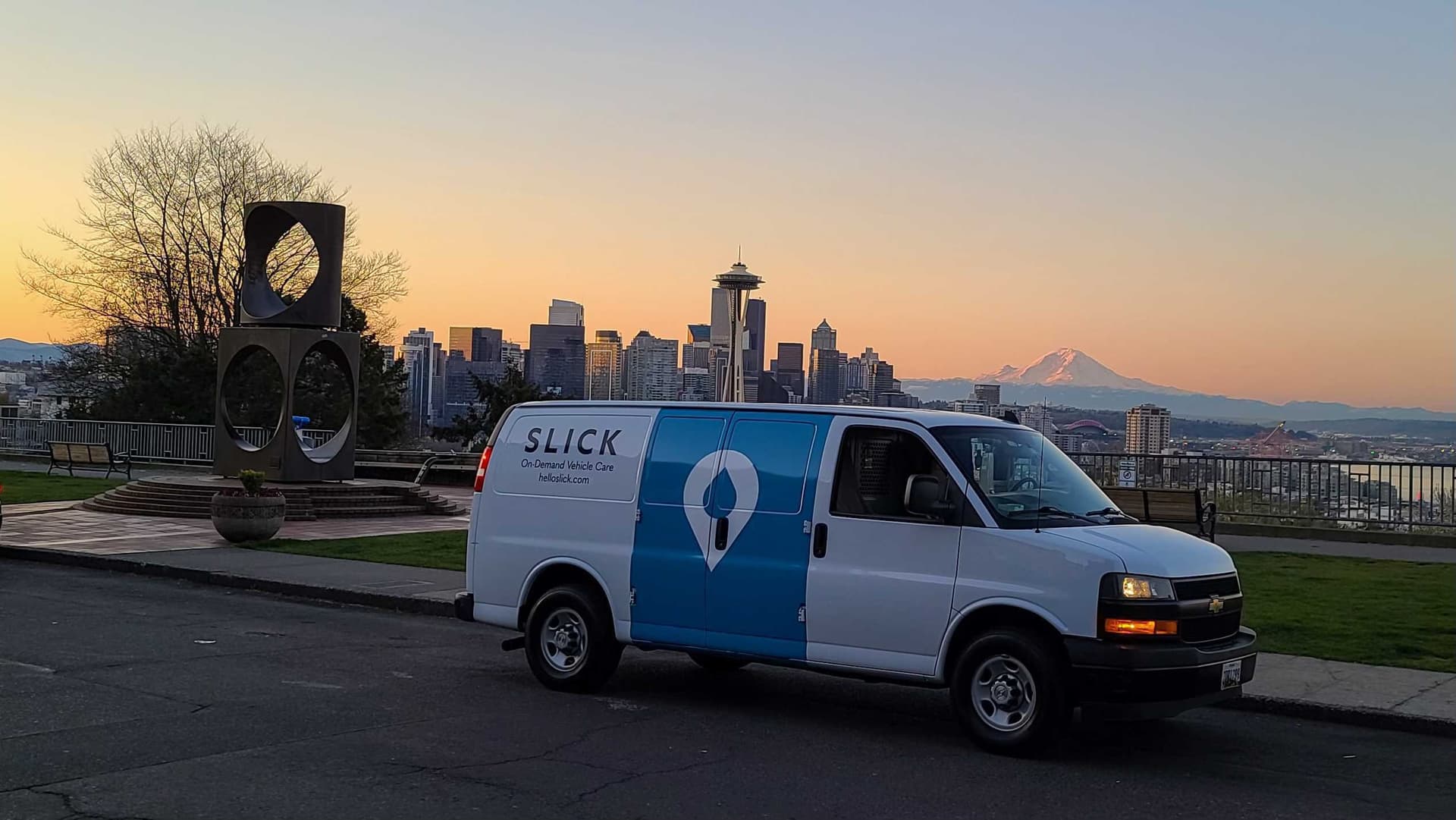 Slick service van and technician working on a fleet yard
